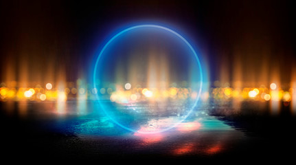 Neon circle, wet asphalt, reflection. Neon circle with the center of a dark empty scene with spotlights. Abstract light. Lights of the night city, abstract light bokeh, smog, smoke.