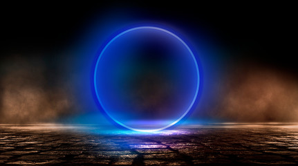 Neon circle, wet asphalt, reflection. Neon circle with the center of a dark empty scene with spotlights. Abstract light. Lights of the night city, abstract light, smog, smoke.