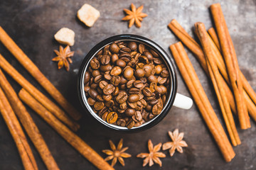 Metal cup full of coffee beans. Selective focus. Shallow depth of field.