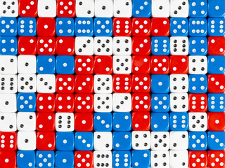 Background pattern of random ordered red, white and blue dices