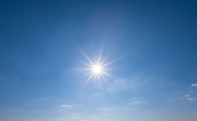 Fototapeta na wymiar sparkle sun on the blue sky, natural background