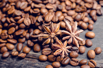 Coffee beans on the wooden table. Selective focus. Shallow depth of field.