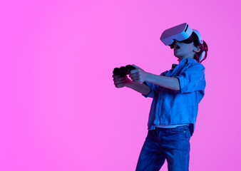 Boy gaming in VR goggles 