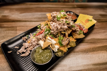 Nachos with cheese and chicken pieces served in a Mexican restaurant in Rovaniemi, Finland