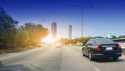 Car parked on road and Small passenger car seat on the road used for daily trips