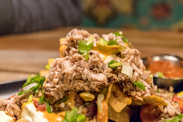 Nachos with cheese and chicken pieces served in a Mexican restaurant in Rovaniemi, Finland