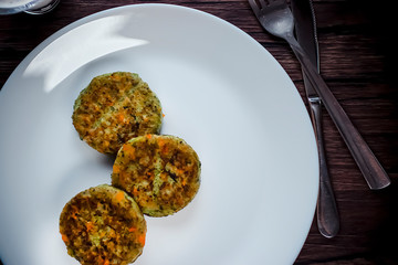 Vegetable patties on a white plate. Vegetarian food.