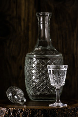 Carafe with vodka and a glass of vodka.