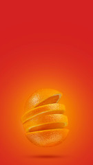 Orange sliced on a bright red background. Minimum fruit concept.