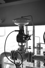 Level control valve open or closed by command form level transmitter,level gauge for monitor liquid level in the system.Black and white.