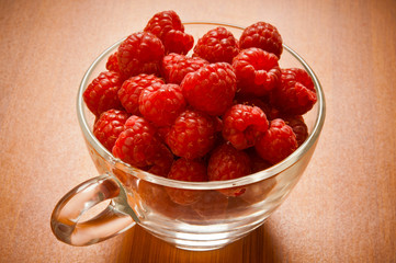 raspberries fruit in bowl like summer fruits and healthy food 