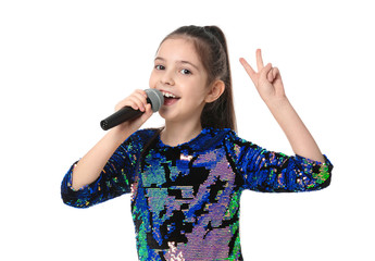 Little girl singing into microphone on white background