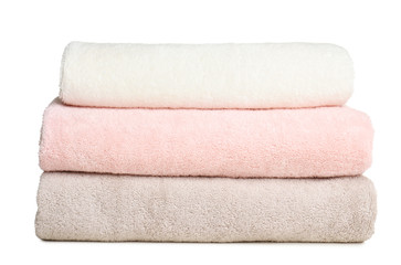 Fototapeta na wymiar Folded soft terry towels on white background