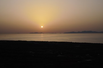 Mediterranean sea with a beautiful sunset near Santorini 