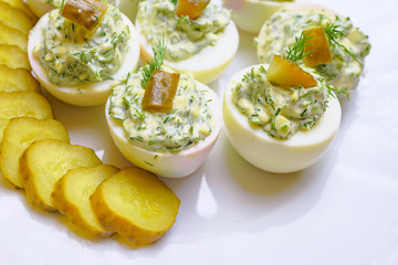 Deviled eggs with greens and pickles