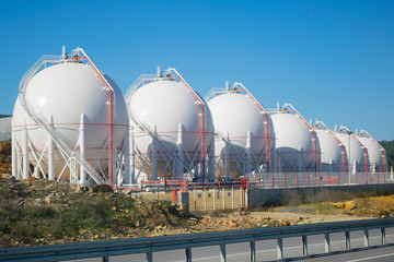 LNG or LPG storage plant, seven liquefied natural gas tanks - obrazy, fototapety, plakaty