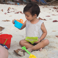 Children are always happy when playing sea water.