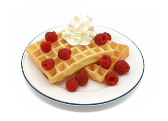  fresh belgian waffles with raspberrys  and whipped cream on a plate isolated on white background
