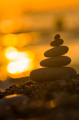 stack of zen stones on pebble beach