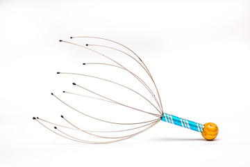 Hand-held head massager with metal handle on the white background.