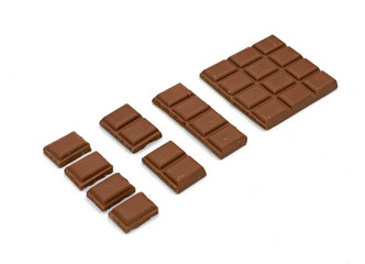 Milk chocolate pieces - isolated on white