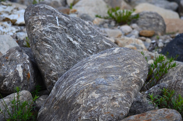 Round patterned stones at the mountain river or sea or ocean
