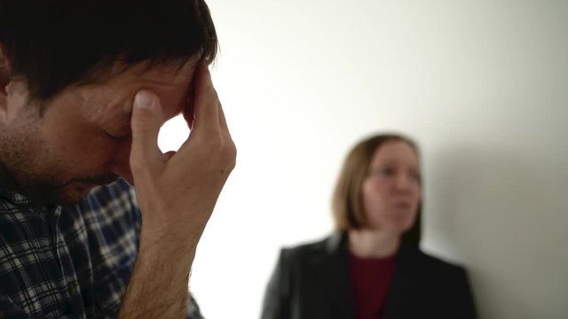 Husband and wife arguing, woman yelling at man in domestic dispute concept