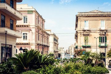 Ancient street with old houses on Ortygia Island, Syracuse (Siracusa), Sicily.