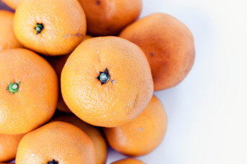 Fresh whole mandarin oranges background , top view.