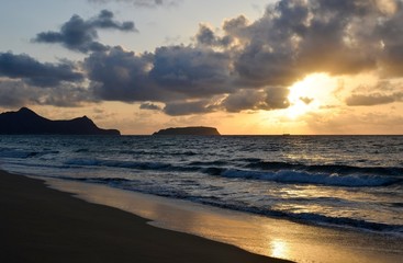 Fototapeta na wymiar Sunset on the island of Porto Santo, view from the sandy beach of the Atlantic Ocean, Portugal