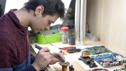 Student repair of electronic devices in electronics workshop