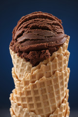 Chocolate ice cream in a waffle cone. Macro shooting