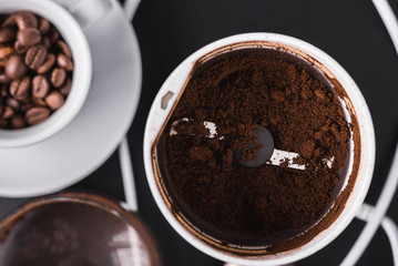 Closeup of freshly milled coffee in a grinder, top view