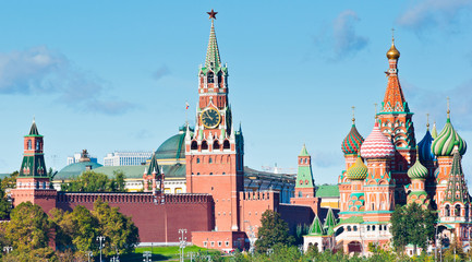 Spasskaya Tower of Moscow Kremlin and Cathedral of Vasily the Blessed (Saint Basil's Cathedral) in sunny day. Red Square. Moscow. Russia