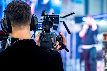 Video operator shoots on camera. Video camera with a transmitting device over Wi-Fi. Video...