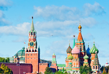 Fototapeta na wymiar Spasskaya Tower of Moscow Kremlin and Cathedral of Vasily the Blessed (Saint Basil's Cathedral) in sunny day. Red Square. Moscow. Russia