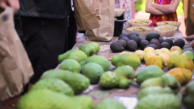 People buying fresh organic vegetables from local farmers in the city bazaar