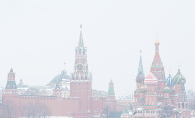 Winter day. Heavy snowfall. Blizzard. Spasskaya Tower of Moscow Kremlin and the Cathedral of Vasily...