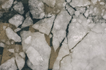 melting ice in the city. broken ice outside