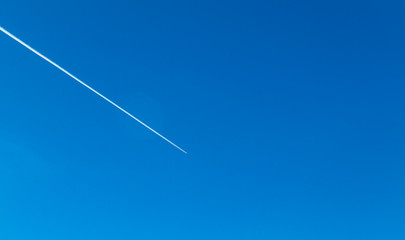 airplane flying in the sky with clouds