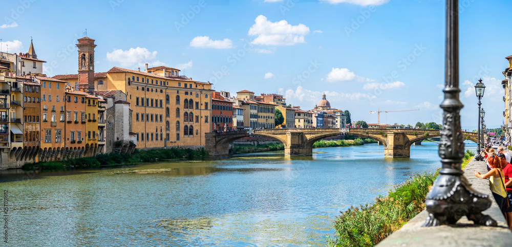 Wall mural panoramic view of medieval arched st trinity bridge (ponte santa trinita) over arno river in florenc