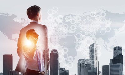Fototapeta premium Concept of business success and control with confident boss against cityscape background