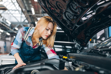 beautiful staff offer repair service. close up photo. girl solving a car problem. copy space