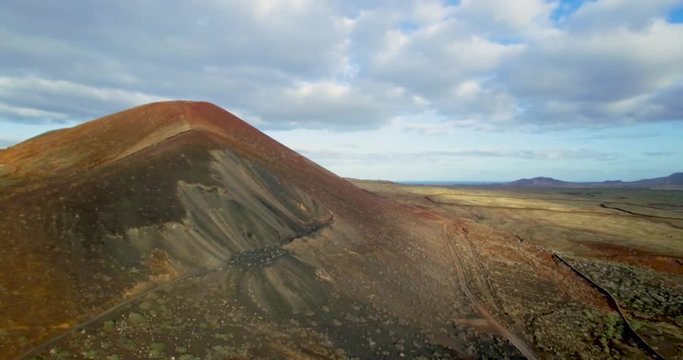 Medium drone shot of volcanic mountain in Fuerteventura.
