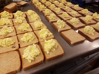 egg salad on many bread slices