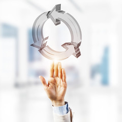 Web refresh icon and male hands as symbol for internet use. Mixed media