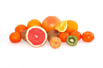 Assortment of whole and sliced exotic fruit on a white background. Kiwi and Mandarin Orange Slices
