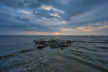 Peaceful beach view and waves during sunset at Jeram, Kuala Selangor Malaysia