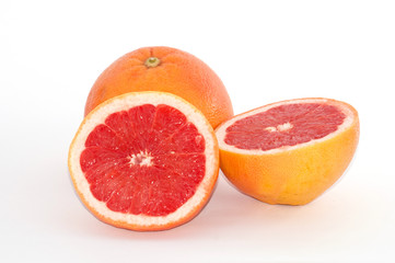 Fototapeta na wymiar Slices of grapefruit macro closeup on white background