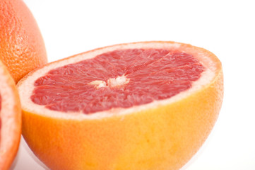 Naklejka na ściany i meble Slices of grapefruit macro closeup on white background